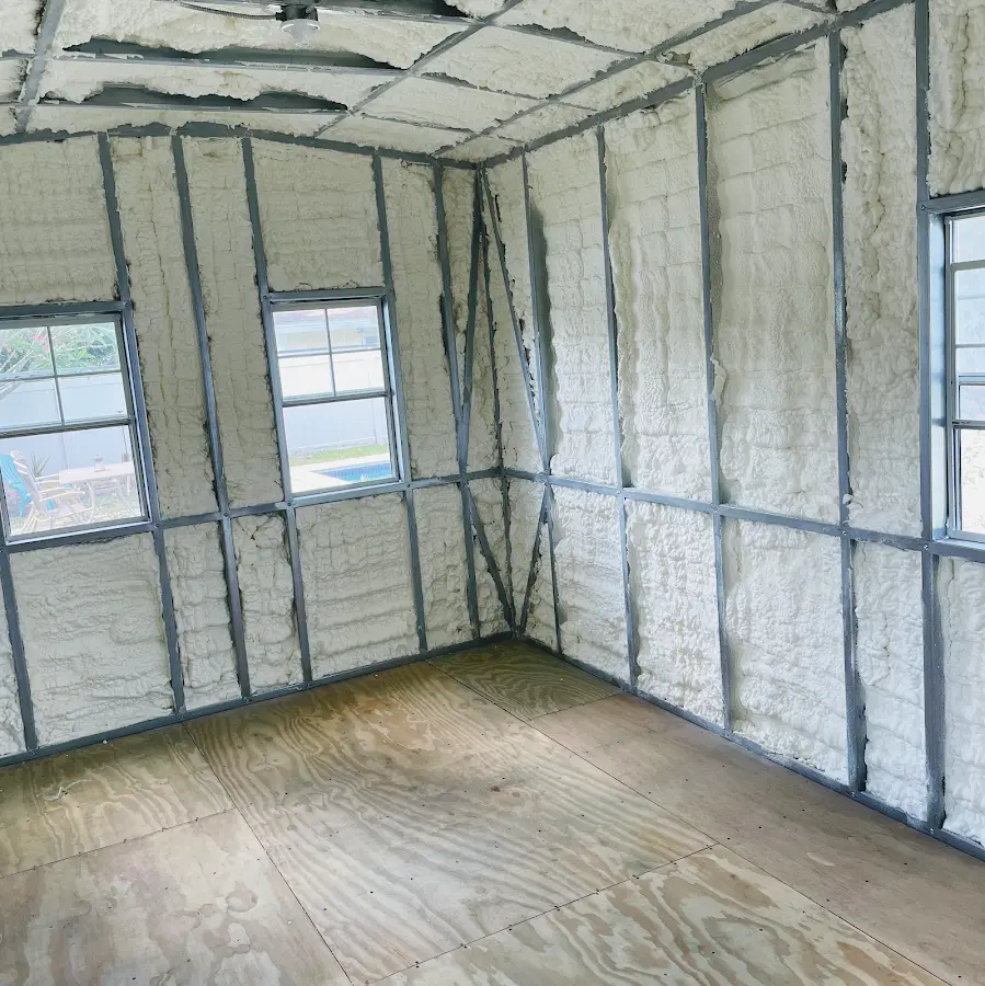 Closed-cell spray foam insulation applied to wall cavities in a residential project in Manassas
